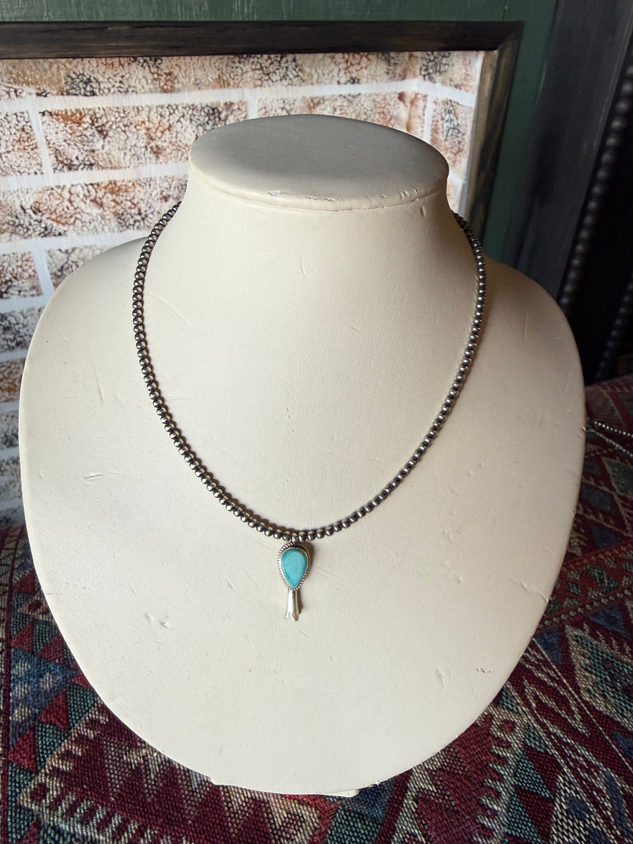 T34 18in. 3mm pearl with attached Turquoise Blossom