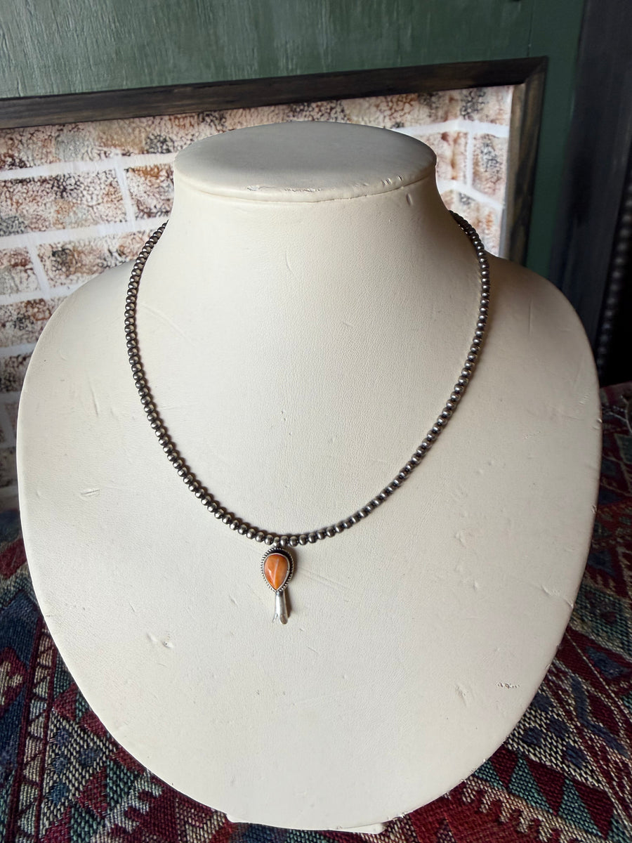 T10 18in. 3mm pearl with attached Spiny Orange Blossom